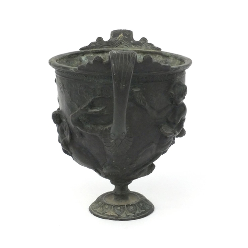 2 - Antique bronze urn embossed with classical scenes, the interior with applied phallic symbol, 14cm hi... 
