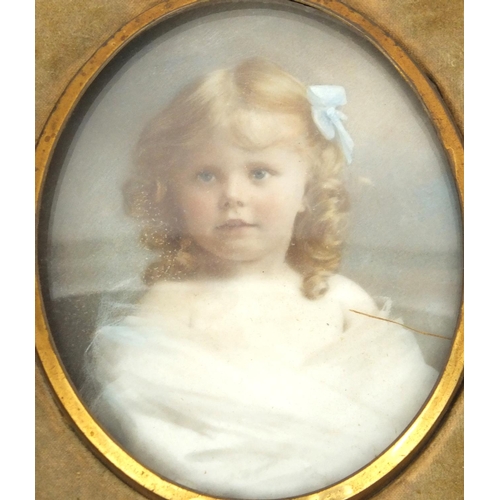 11 - Hand painted portrait miniature onto porcelain of a young girl, housed in a leather case, mounted, t... 