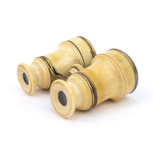 45 - Cased pair of ivory and brass opera glasses, 8cm high