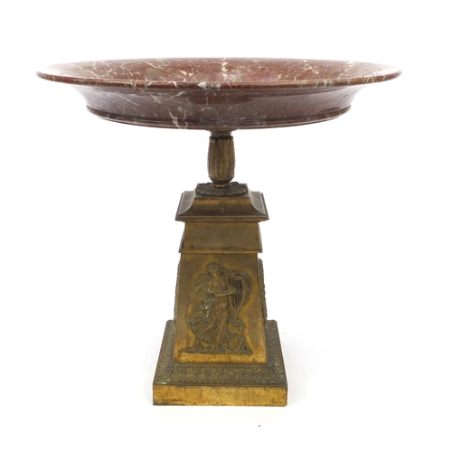 4 - Large red variegated marble topped tazza mounted on a tapered brass column decorated in relief with ... 