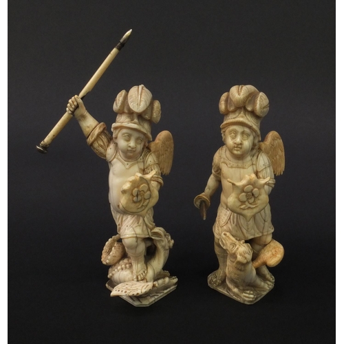 1 - Pair of Continental carved ivory winged figures of soldiers, the largest 18cm high