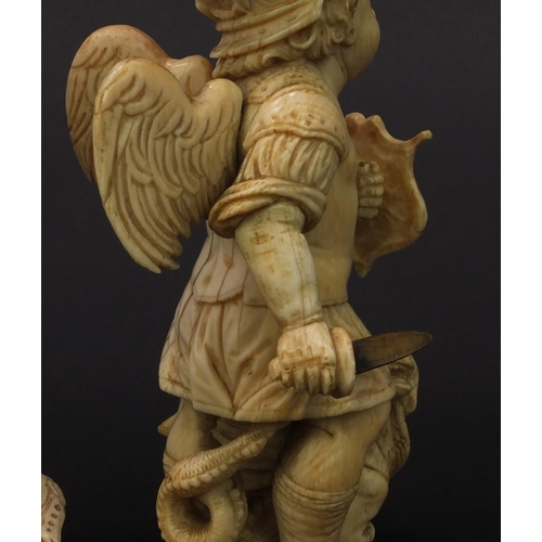 1 - Pair of Continental carved ivory winged figures of soldiers, the largest 18cm high