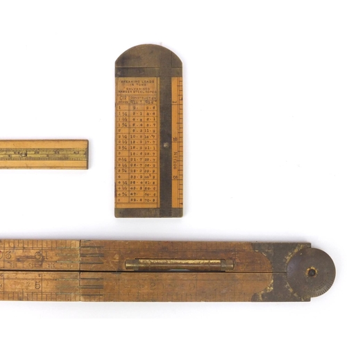 43 - Three wooden and brass rules including a Rabone example with inset spirit level numbered 1190, and a... 