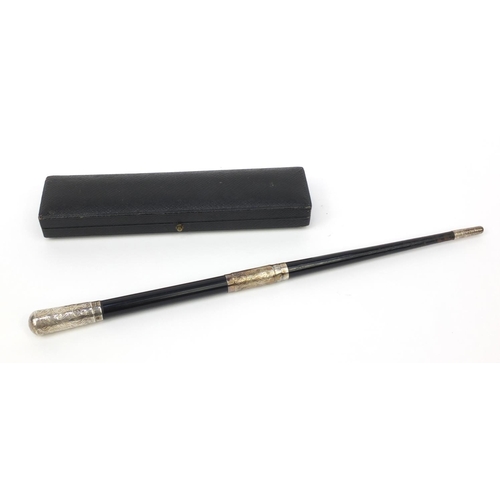 358 - Ebonised conductors baton with chased silver mounts, housed in a fitted Boosey & Co London case, the... 