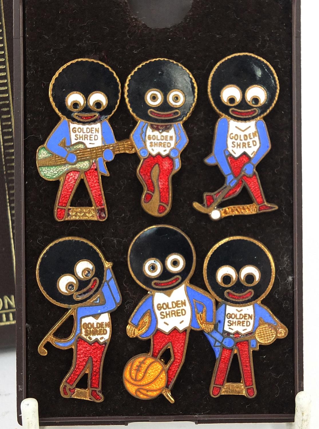 Group of vintage James Robertson golden shred badges including the 1940