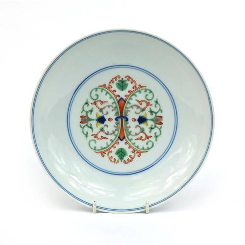 363 - Chinese porcelain shallow dish, hand painted in the Wucai palette with foliate scroll within blue ri... 