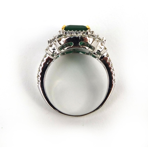 927 - 18ct white gold emerald and diamond ring, set with approximately ninety diamonds, size K, approximat... 