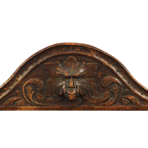 2059 - Victorian oak hall table with tooled leather insert and frieze drawer, carved with grotesque faces a... 
