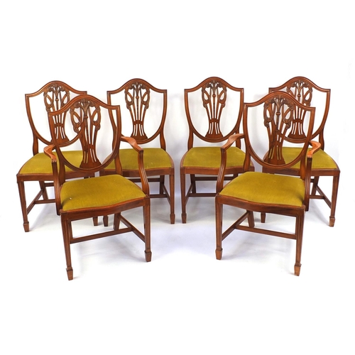 2028 - Yew twin pedestal D-end dining and six dining chairs including two carvers, each carved with The Pri... 
