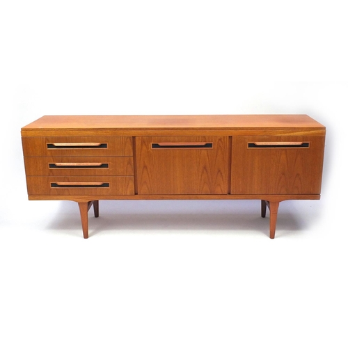2022 - 1970s teak sideboard fitted with three drawers and a pair of cupboard doors, 72cm high x 181cm wide ... 