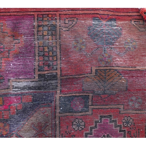 2013 - Rectangular Bakhtiari rug with an all over floral design within geometric floral borders onto a red ... 