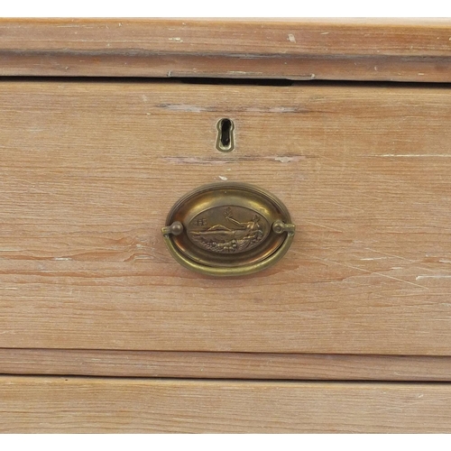 2024 - Bleached wooden four drawer chest with oval brass handles embossed with a classical reclining lady, ... 