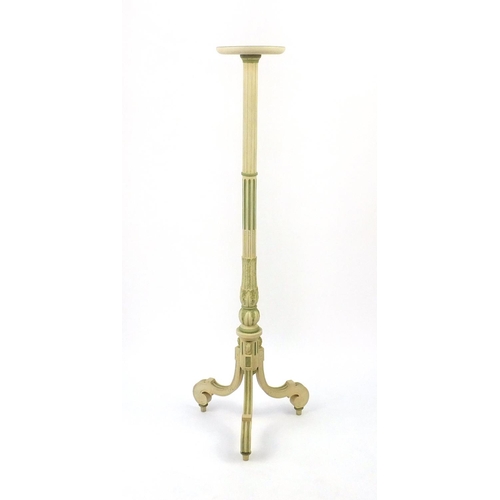 2048 - Cream and gilt painted torchère with reeded column on tripod base, 142cm high