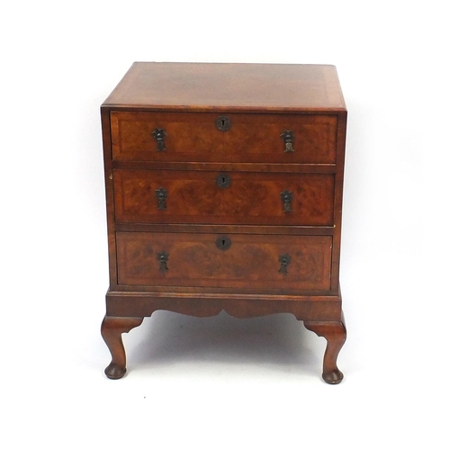 2052 - Walnut cross banded and feather banded three drawer chest on cabriole legs, 77cm high x 61cm wide x ... 