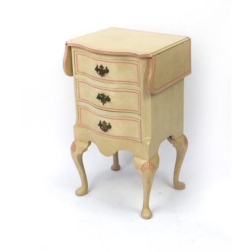2026 - Cream and pink painted three drawer serpentine fronted chest with drop sides, 73cm high