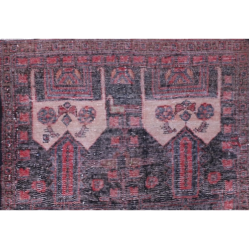 2055 - Rectangular Baluchi rug decorated with animal and floral motifs onto a red and dark blue ground, 230... 