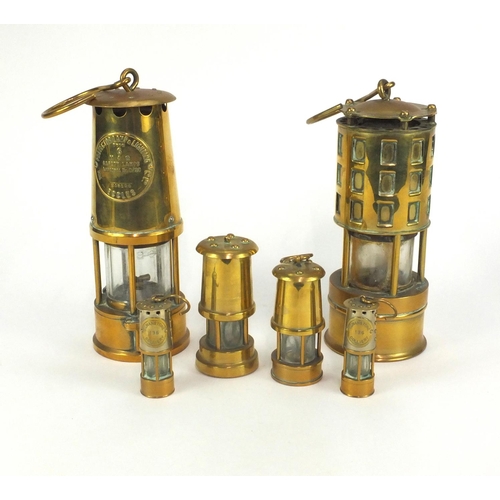 56 - Six brass miners lamps including Kaehler and Eccles examples, the largest 23cm high