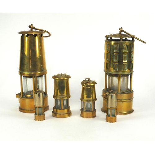 56 - Six brass miners lamps including Kaehler and Eccles examples, the largest 23cm high