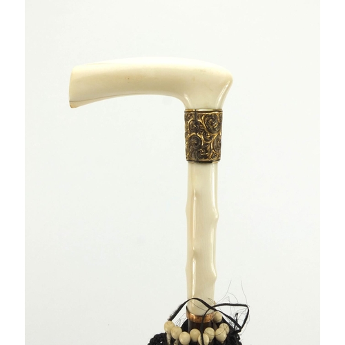29 - Edwardian silk parasol with ivory handle and gilt metal mounts, 69cm in length