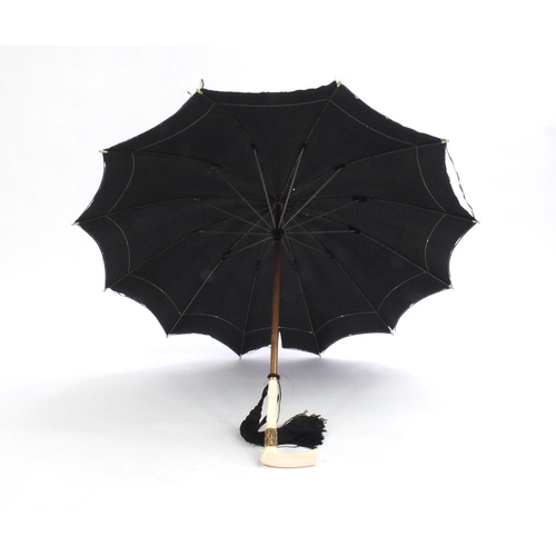 29 - Edwardian silk parasol with ivory handle and gilt metal mounts, 69cm in length