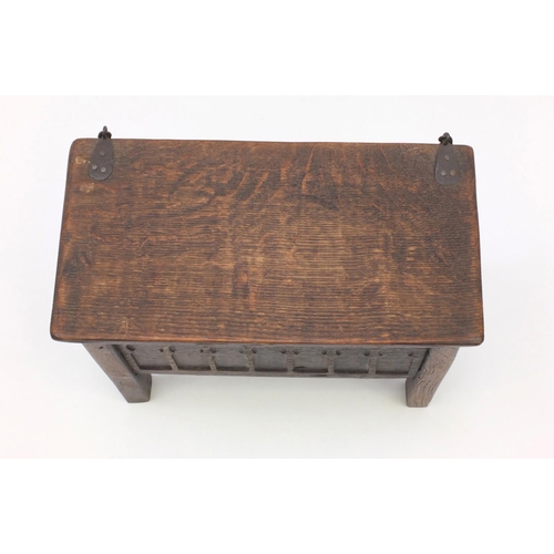41 - Antique oak plank coffer of small proportions with hinged lid, the front panel with gothic arches, 3... 