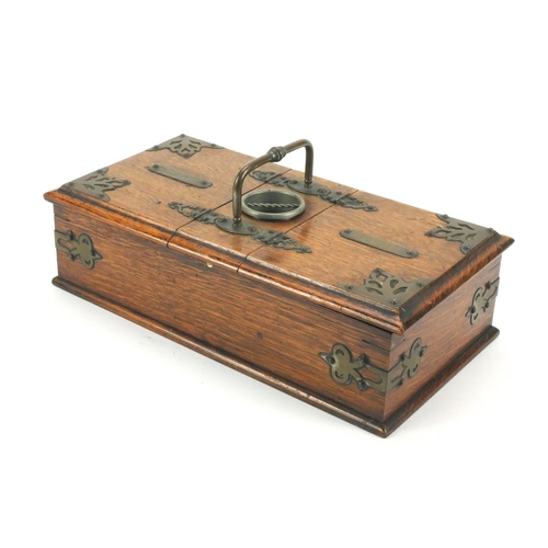 45 - Edwardian oak smokers travelling box with brass mounts, carrying handle and two compartments, 13cm h... 
