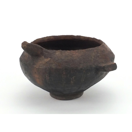 49 - Antique pottery vessel with spout and twin handles, 12.5cm high