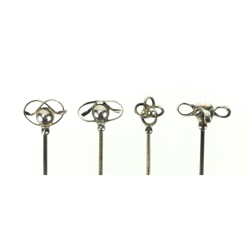 9 - Four Art Nouveau silver hat pins by Charles Horner, all stamped sterling, the largest 17cm in length