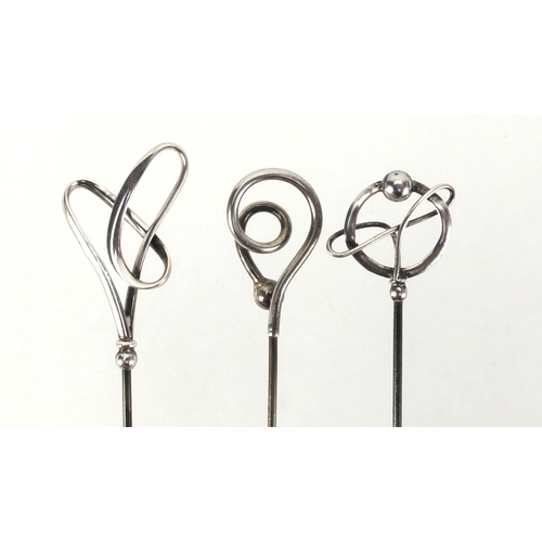 7 - Three Art Nouveau silver hat pins by Charles Horner, various hallmarks, the largest 24.5cm in length