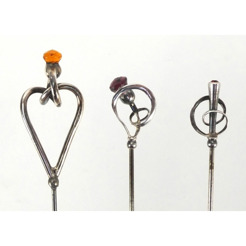3 - Three Art Nouveau silver hat pins by Charles Horner, one set with a citrine, one with an amethyst an... 