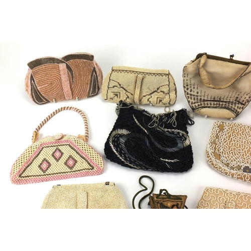 21 - Twelve predominantly beadwork clutch bag and purses, together with a embroidered miser's purse and a... 