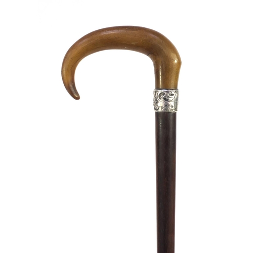31 - Harwood walking stick with rhino horn handle and silver collar, with floral decoration and engraved ... 