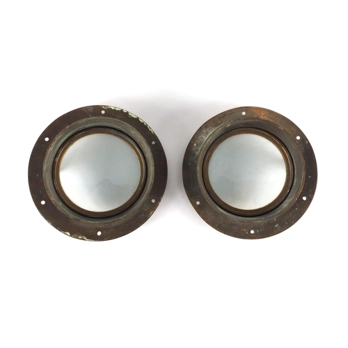 53 - Pair of shipping interest bronze and glass port holes, each 25cm in diameter