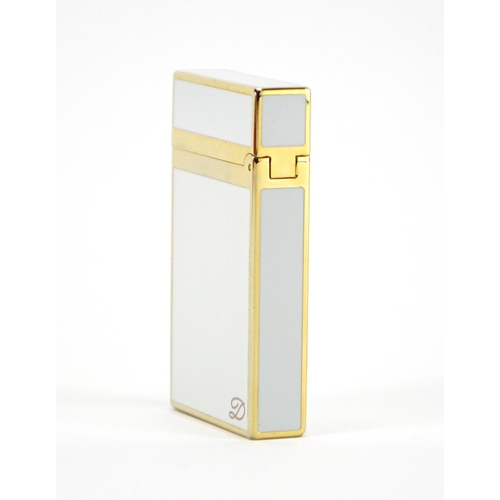 52 - S. T. Dupont gold plated and white enamelled pocket lighter with fitted case and box, serial number ... 