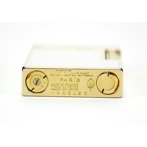 52 - S. T. Dupont gold plated and white enamelled pocket lighter with fitted case and box, serial number ... 