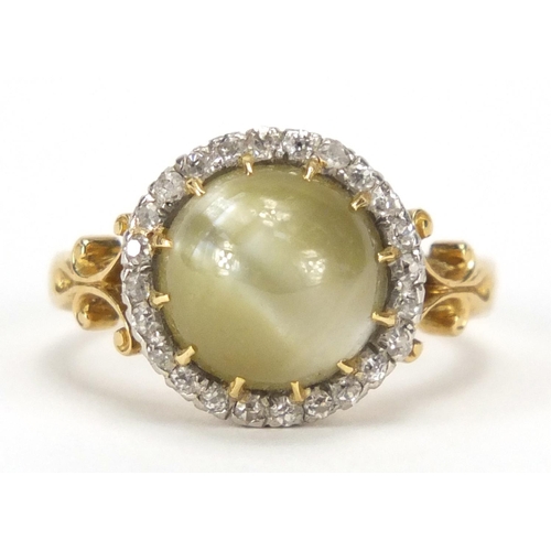 656 - 18ct gold green cabochon tiger's eye and diamond ring with scroll shoulders, the band stamped R.P po... 
