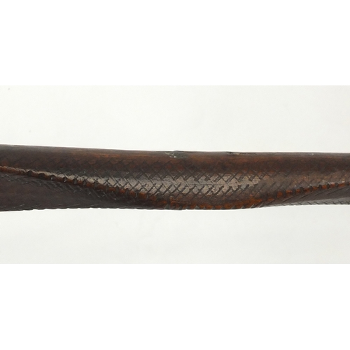371 - Andaman Islands wood bow of double paddle form, with incised decoration, 197cm in length