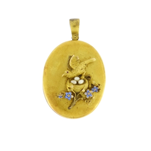 965 - Victorian unmarked gold locket by Harry Emanuel, relief decorated with a bird in a nest with pearl e... 