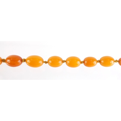 11 - Butterscotch amber coloured bead necklace, 100cm in length, 49.8g