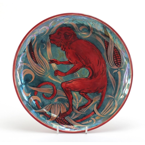 17 - Arts & Crafts lustre pottery plate in the style of William de Morgan, hand painted with a monkey and... 