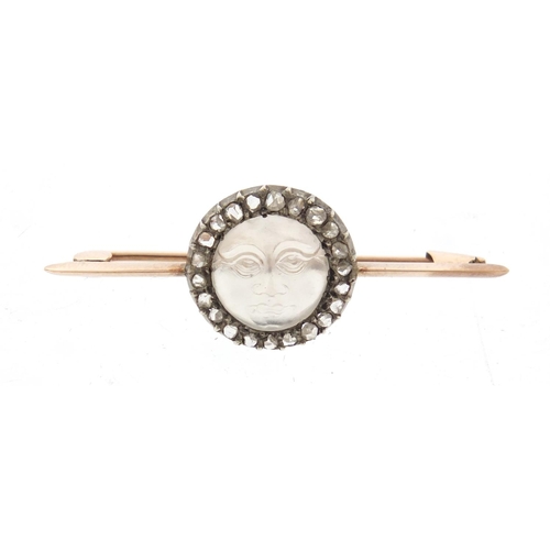91 - Unmarked gold moonstone and diamond bar brooch, carved with a moon face, housed in a Collingwood Ltd... 