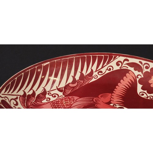 16 - Arts & Crafts ruby lustre charger by William de Morgan, hand painted with a stylised bird, impressed... 
