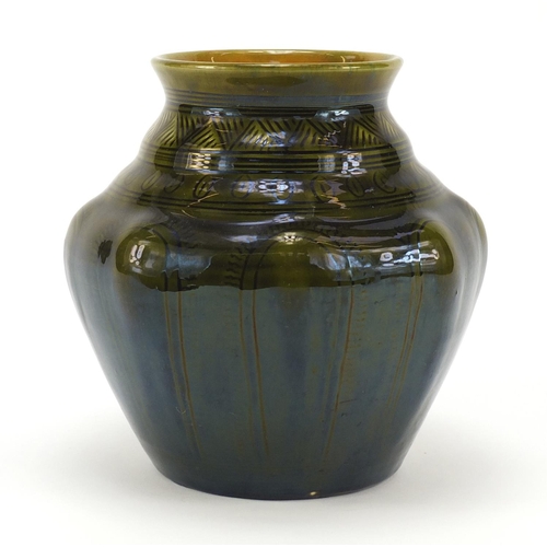 56 - Christopher Dresser for Linthorpe Pottery, Arts & Crafts pottery vase having a green glaze and incis... 