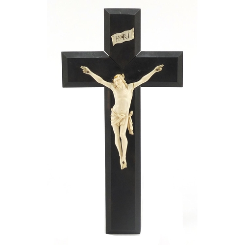 26 - 19th century carved ivory Corpus Christi on ebonised crucifix, 27.5cm high