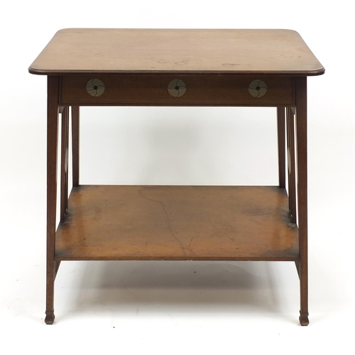 1464 - Leonard Wyburd for Liberty & Co, mahogany table with undertier inset with stylised pewter roundels, ... 