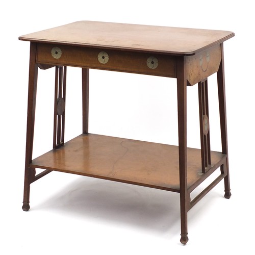 1464 - Leonard Wyburd for Liberty & Co, mahogany table with undertier inset with stylised pewter roundels, ... 
