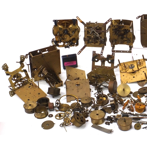 Collection of vintage clock movements, parts and accessories including