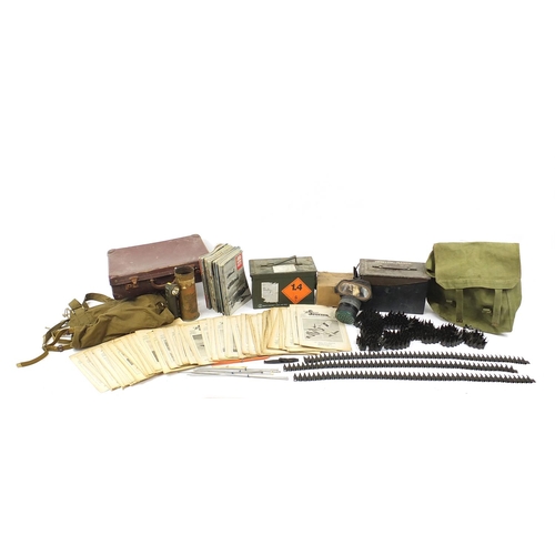 Militaria including ammunition tins, trench art shell case engraved with a dragon and gas mask