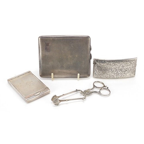 526 - Silver items comprising Georgian sugar nips, cigarette case, compact and calling card case, various ... 