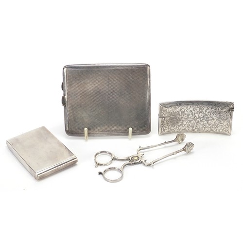 526 - Silver items comprising Georgian sugar nips, cigarette case, compact and calling card case, various ... 